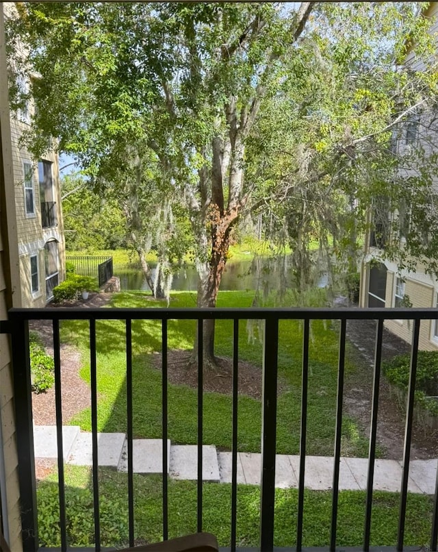 balcony featuring a water view