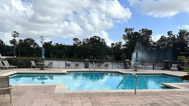 view of swimming pool with a patio area