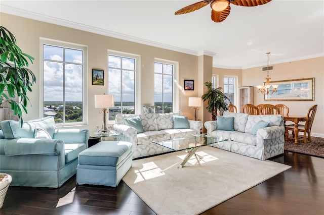 living room featuring dark wood-type flooring, ceiling fan with notable chandelier, and crown molding