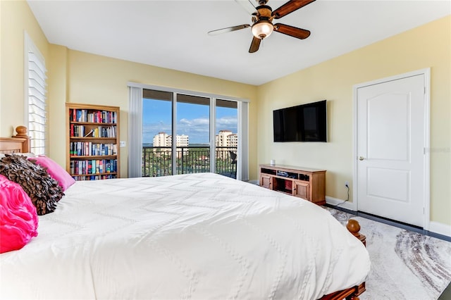 bedroom featuring ceiling fan and access to exterior