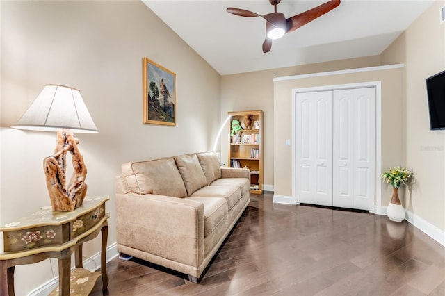 living room featuring ceiling fan and dark hardwood / wood-style flooring