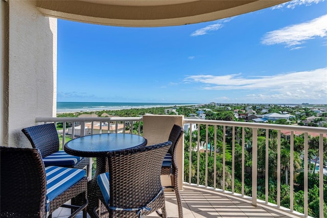 balcony with a view of the beach and a water view