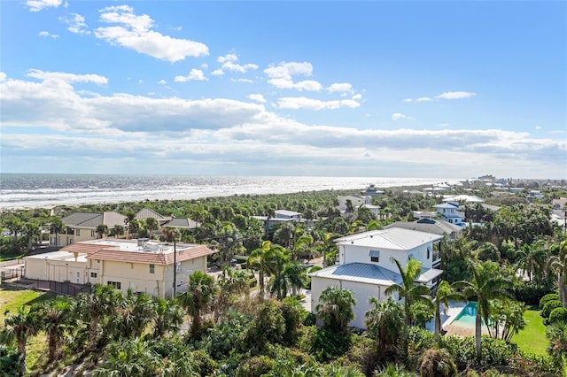 bird's eye view featuring a view of the beach and a water view