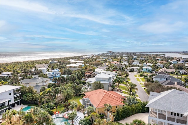 birds eye view of property featuring a water view and a view of the beach