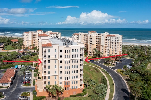 aerial view with a beach view and a water view