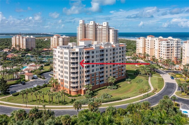 birds eye view of property with a water view