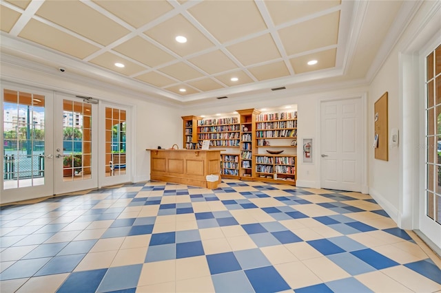 interior space with coffered ceiling, french doors, and ornamental molding