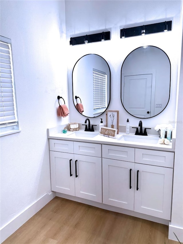 bathroom featuring hardwood / wood-style floors and vanity