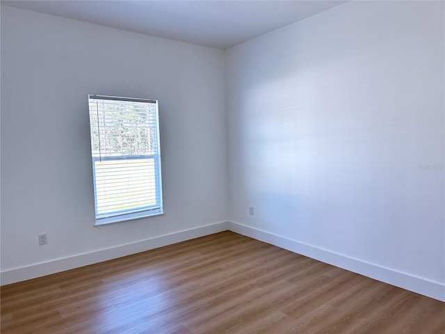 unfurnished room featuring hardwood / wood-style floors