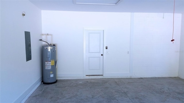 garage featuring electric panel and water heater