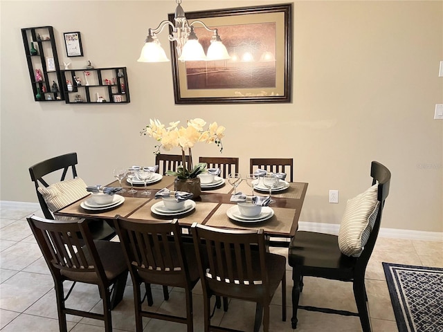 dining room with light tile patterned floors and an inviting chandelier