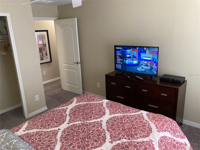 bedroom featuring a closet and dark carpet