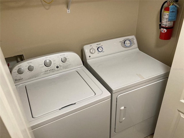 laundry room featuring separate washer and dryer