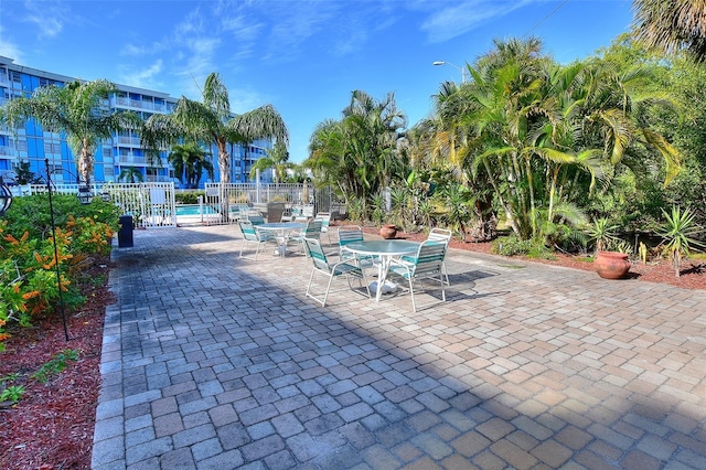 exterior space with a pool, a patio, and fence