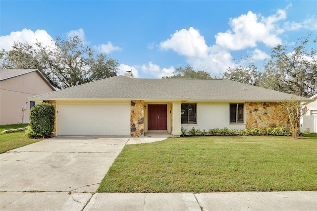 ranch-style home with a front yard and a garage