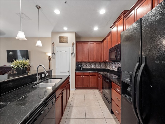 kitchen with tasteful backsplash, dark stone countertops, black appliances, pendant lighting, and sink