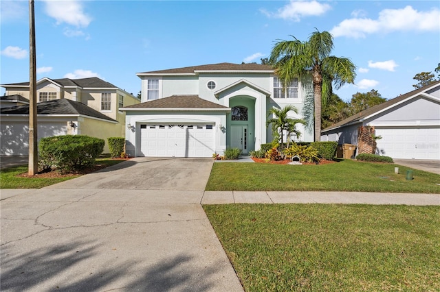 view of front of property with a front lawn and a garage