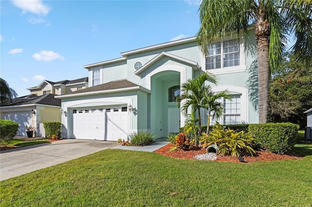 1055 Lake Berkley Dr, Kissimmee, FL 34746 - view of front facade featuring stucco siding, a front lawn, concrete driveway, and a garage