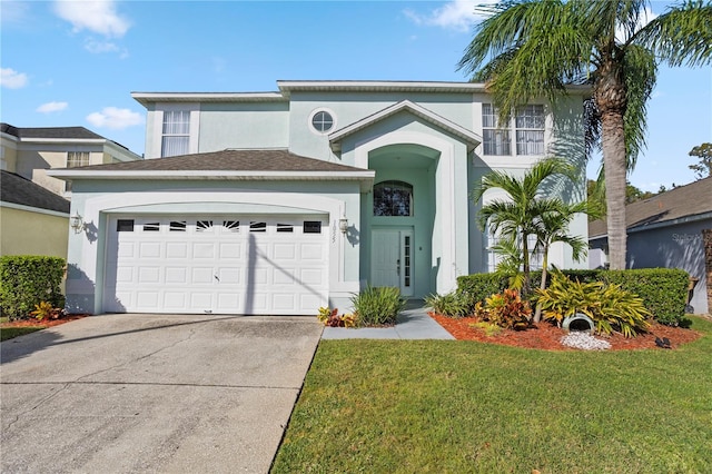 view of front of property featuring a front yard and a garage