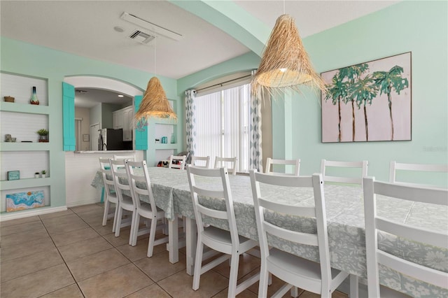 dining room featuring light tile patterned floors