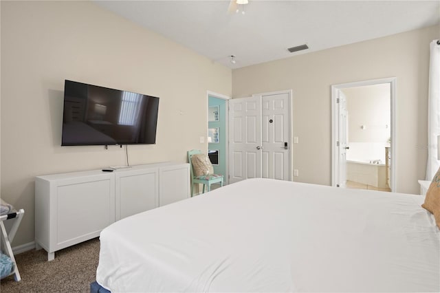 carpeted bedroom featuring ensuite bath and ceiling fan