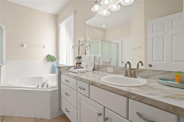 bathroom featuring vanity, tile patterned flooring, and plus walk in shower