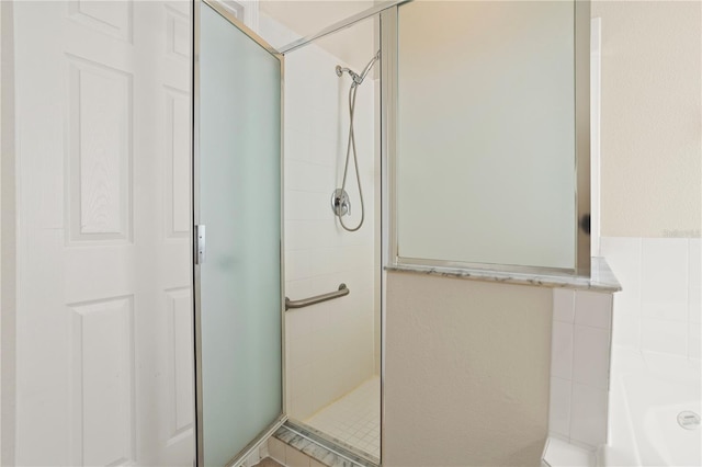 bathroom featuring plus walk in shower