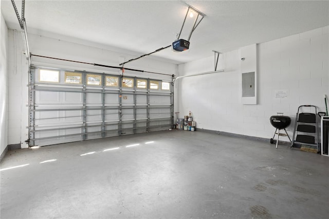 garage with electric panel and a garage door opener