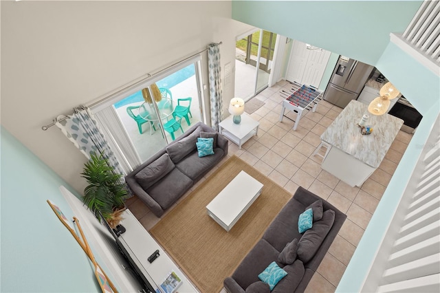 1055 Lake Berkley Dr, Kissimmee, FL 34746 - living room featuring tile patterned floors and a high ceiling
