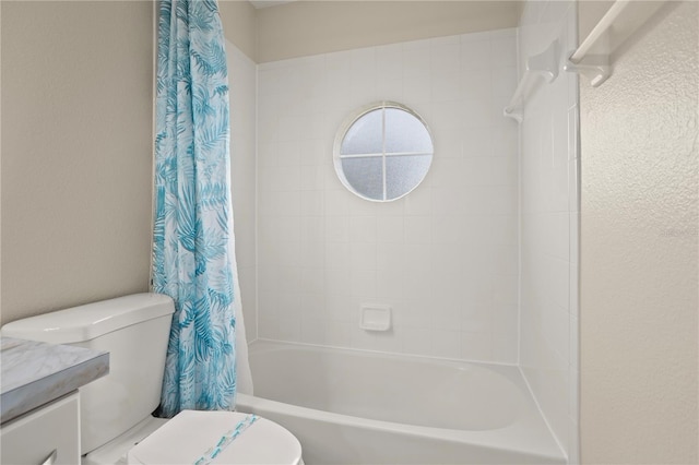 full bathroom with shower / tub combo, vanity, and toilet