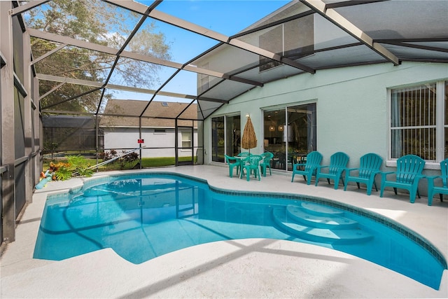 view of pool featuring a lanai and a patio area