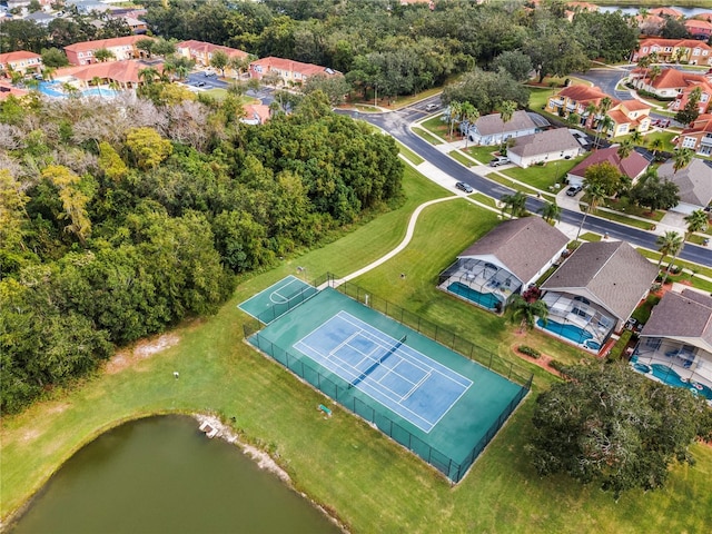 birds eye view of property with a water view