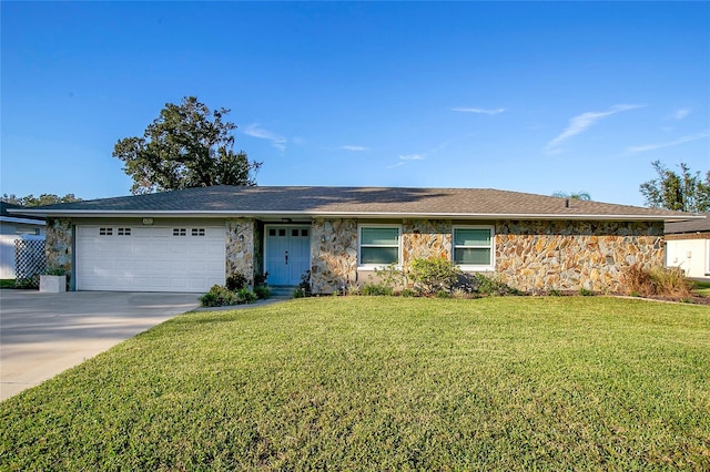 ranch-style home with a front yard and a garage