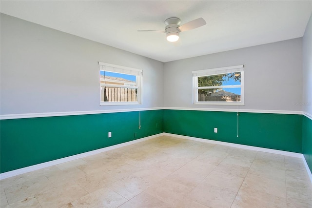 unfurnished room with ceiling fan