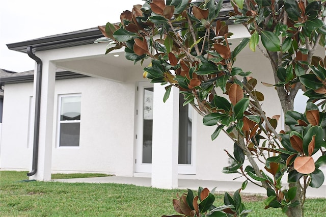 view of side of home featuring a yard