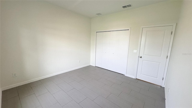 unfurnished bedroom with a closet