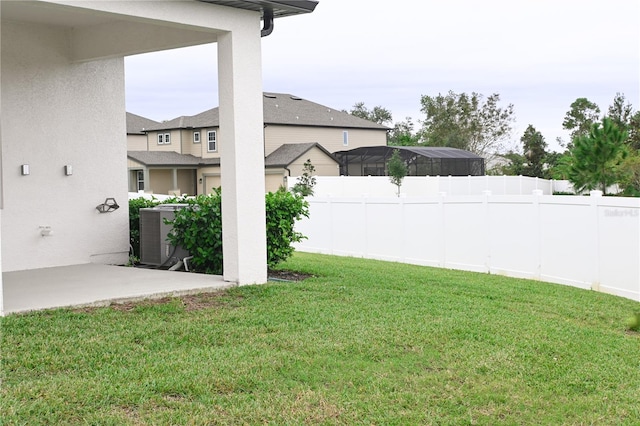 view of yard with a patio and central AC unit