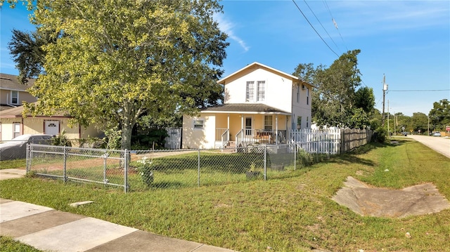 view of front of property featuring a front lawn and covered porch