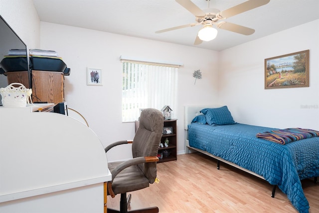 bedroom featuring hardwood / wood-style flooring and ceiling fan