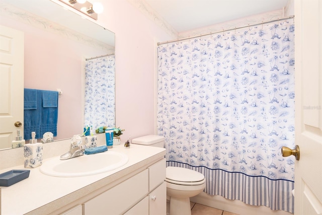 bathroom with vanity, a shower with shower curtain, toilet, and tile patterned floors