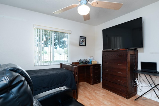 bedroom with light wood-type flooring and ceiling fan