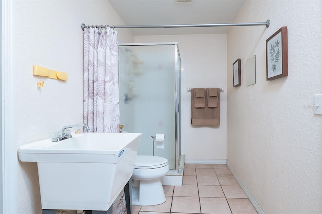 bathroom with toilet, sink, tile patterned flooring, and a shower with shower curtain