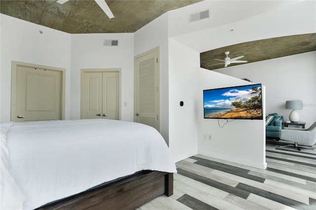 bedroom with light wood-type flooring and ceiling fan