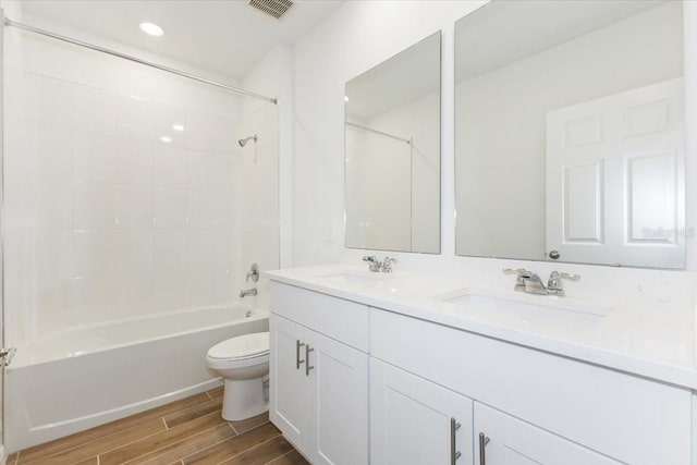 full bathroom featuring vanity, shower / bathing tub combination, and toilet