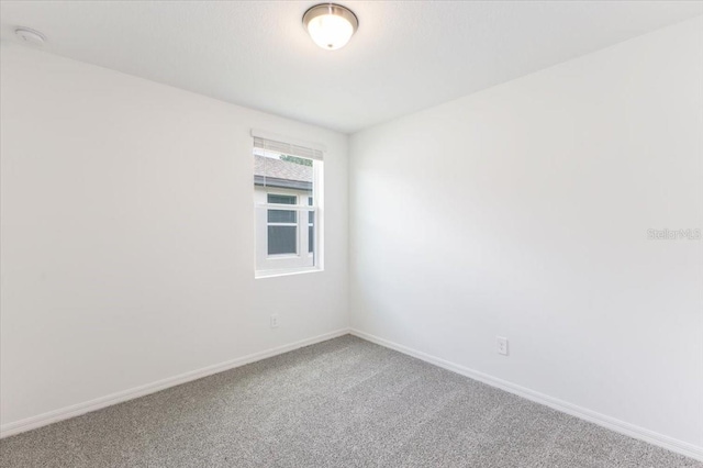 unfurnished room with carpet flooring