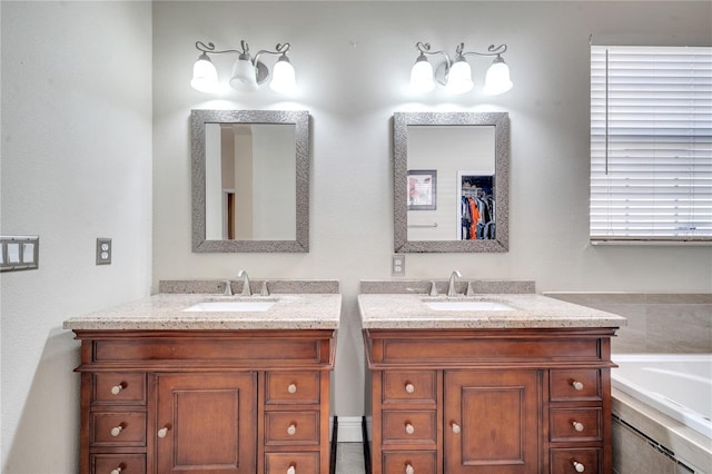 bathroom with vanity and a tub to relax in