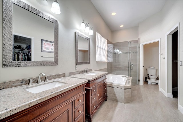 full bathroom with vanity, toilet, and independent shower and bath