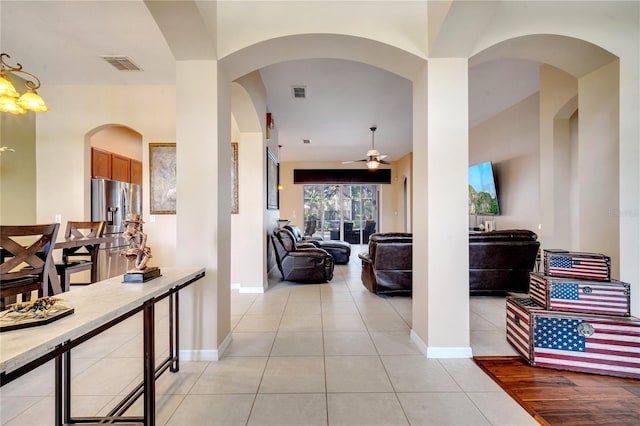 hallway featuring light tile patterned flooring