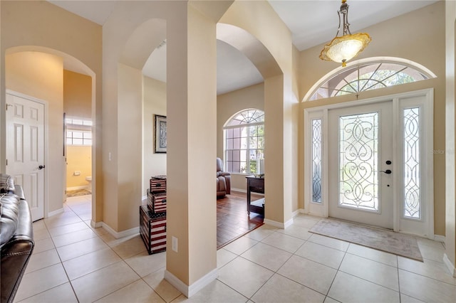 foyer entrance with light tile patterned flooring