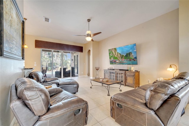 living room with ceiling fan and light tile patterned flooring